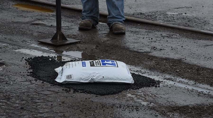 pothole-repairs-along-railroad-tracks-railway-level-crossing